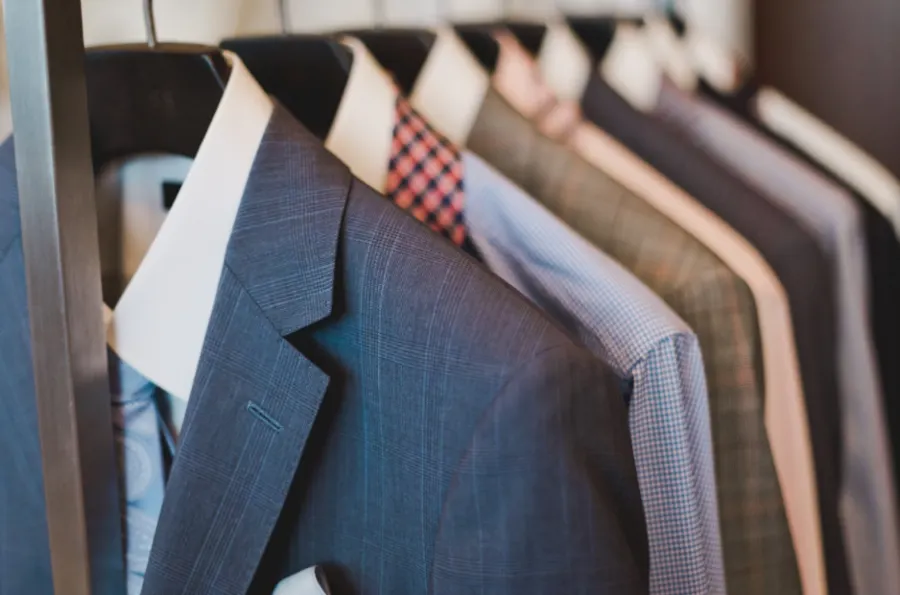 Suits on a rail for corporate dry cleaning
