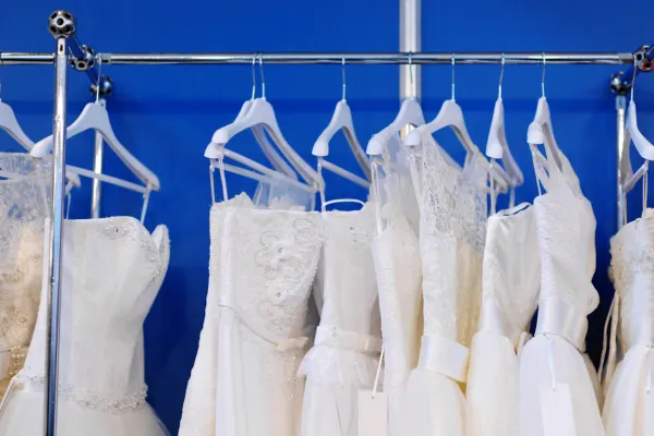 Wedding dresses on a rail after professional dry cleaning